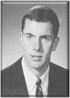 A person wearing a suit and tie posing for a photo

Description automatically generated